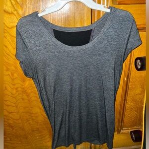 Gray and black short sleeve work out shirt ties in back with opening and mesh